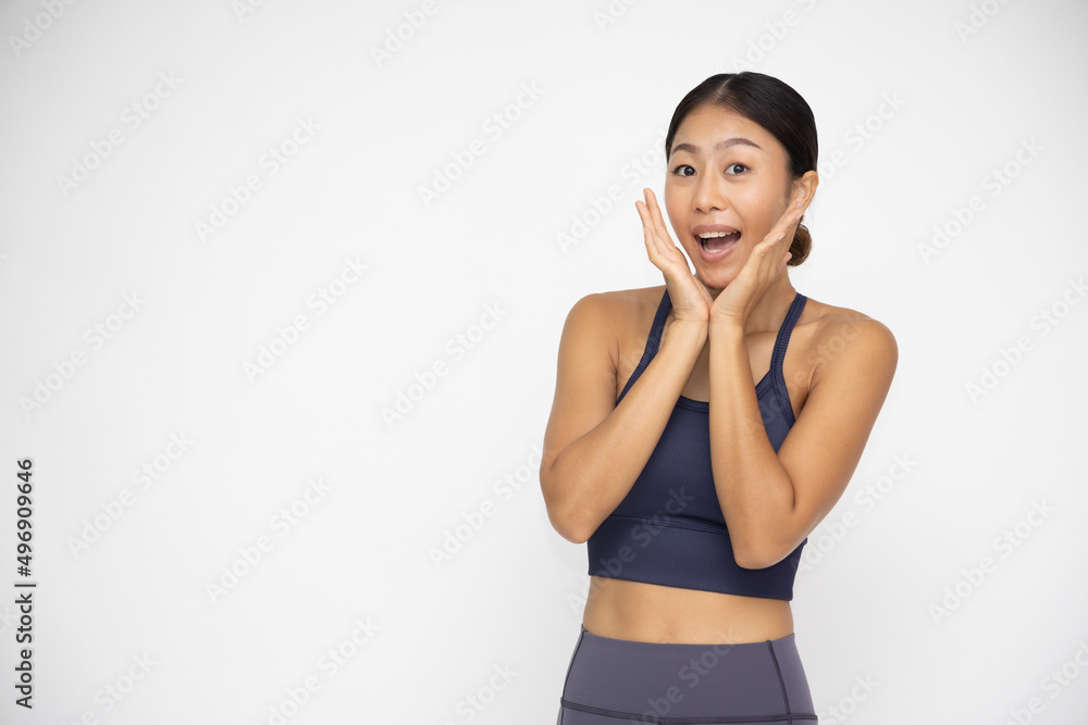 Young Asian woman yoga instructor surprise isolated over white background, Thrilled excited concept