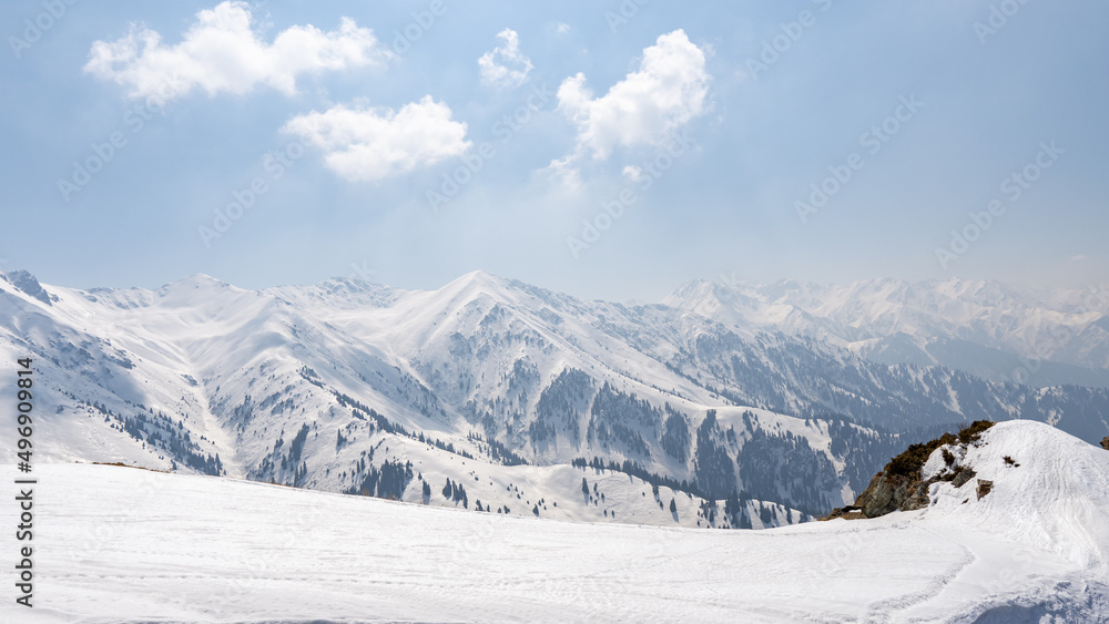 snow-white mountain peaks on a sunny day