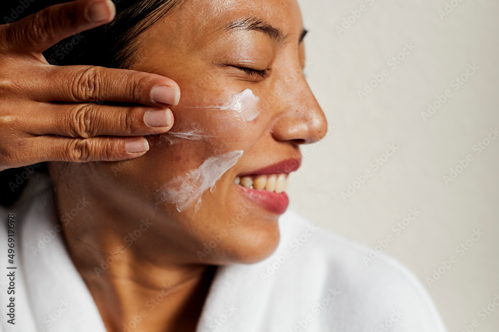 pretty woman put the cream on her face pretty woman put the cream on her face