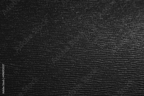 Black coarse texture. Black plastic background
