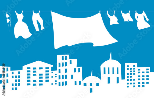 Clothes are hanging on a rope. White city on a blue background. The concept of a clean city. Flat vector illustration. Eps10
