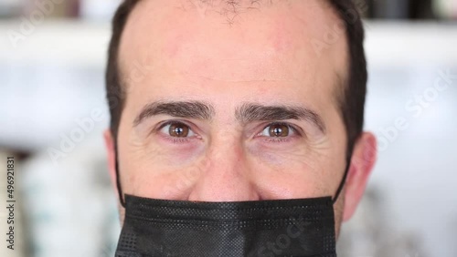Close up portrait of charming mature man in medical face mask