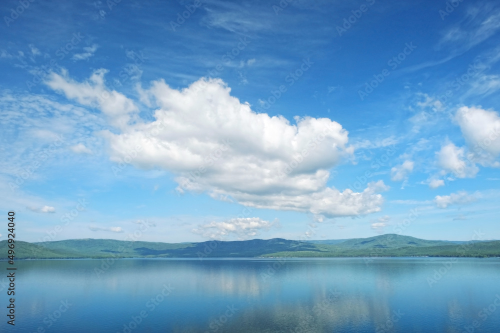 Beautiful summer landscape with big clouds, lake, mountains. abstract natural background. travel, adventure and vacation concept. relax time. Russia, South Ural, lake Turgoyak