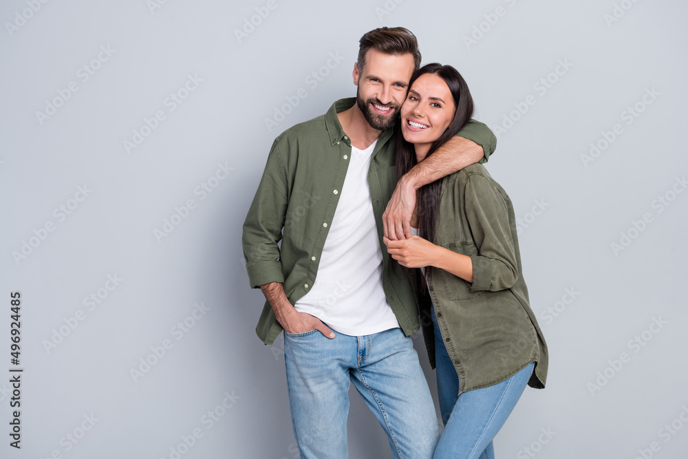 Portrait of attractive tender gentle cheerful couple life partners cuddling romance isolated over grey pastel color background - obrazy, fototapety, plakaty 