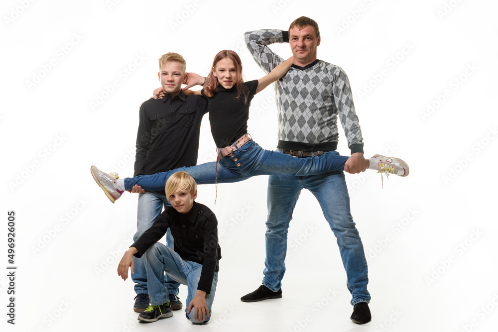 Fototapeta premium Dad and son hold their daughter on a stretch, the second son sits next to him, full-length portrait, white background