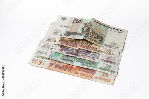 Worn banknotes of fifty, one and five hundred, one and five thousand Russian rubles isolated
