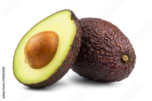 Avocado isolated. Avocado and half of the fruit with leaves on a white background.