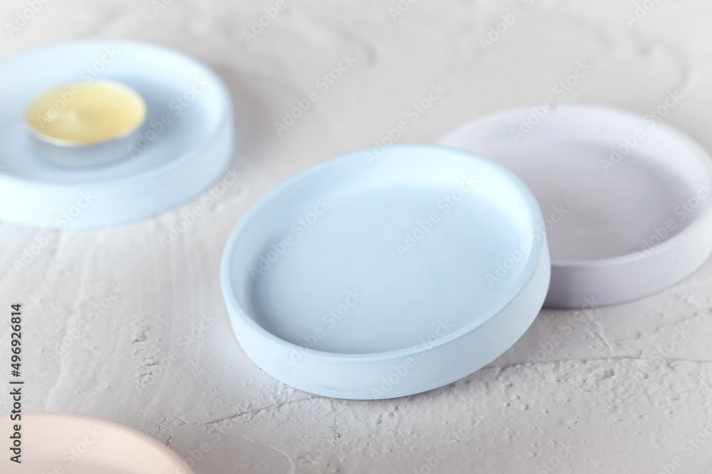the stand is round for candles made of plaster. handmade work. products made of gypsum. the plate is round. the stand is round for candles made of plaster. handmade work. products made of gypsum. the plate is round.