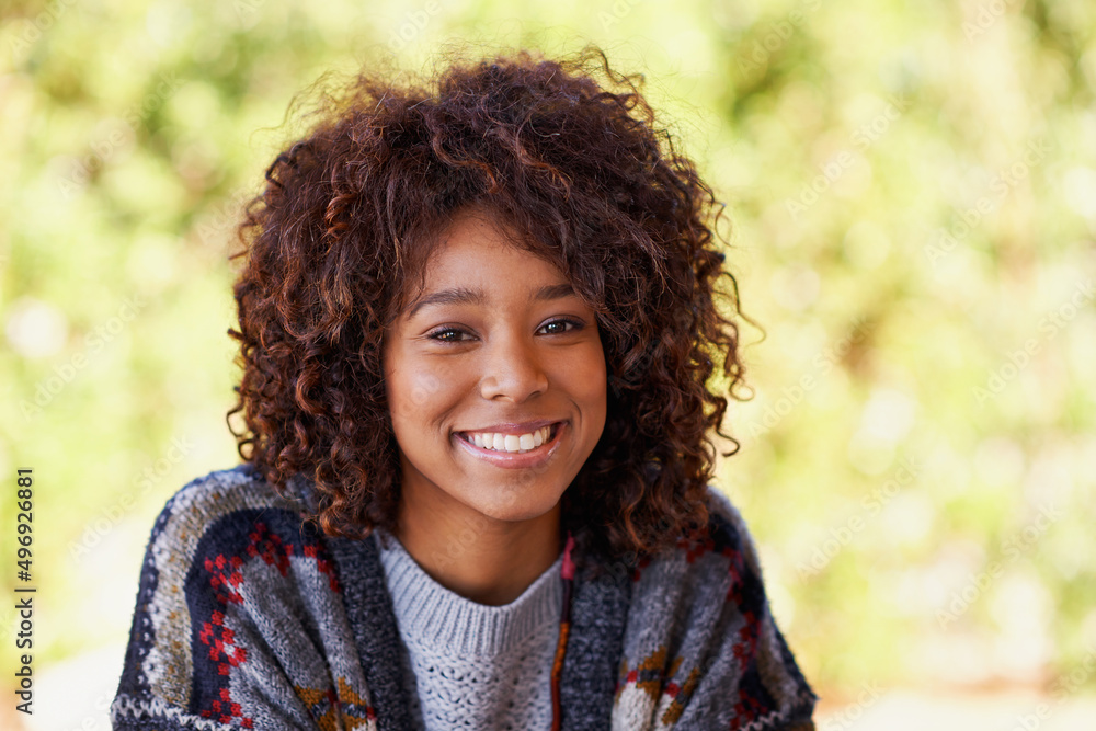 Nothing keeps this girl down. A radiant young black woman smiling broadly at the camera. Nothing keeps this girl down. A radiant young black woman smiling broadly at the camera.