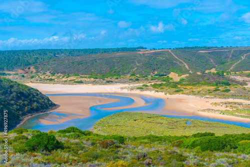 Seixe river flowing into the see in Portugal photo