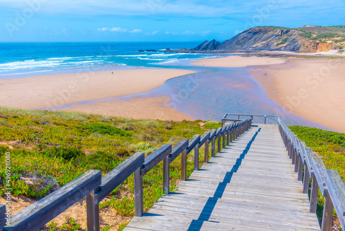 Wooden staircase leading to Praia da Amoreira in Portugal photo