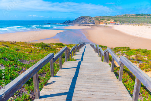 Wooden staircase leading to Praia da Amoreira in Portugal photo