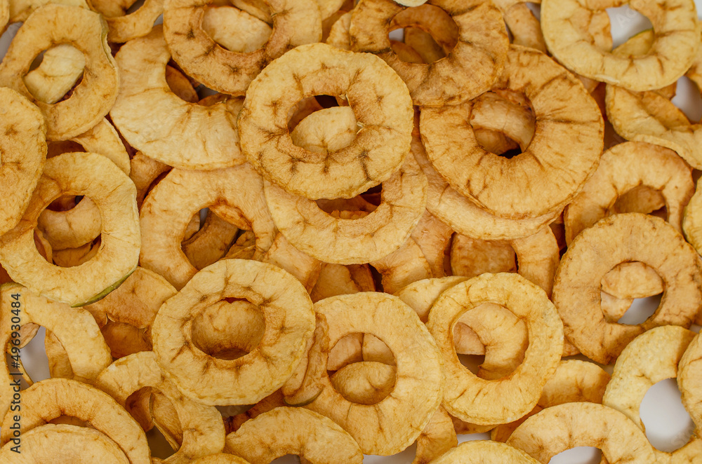 Apple chips. Background of dried fruits. Healthy and tasty food. Apple chips. Background of dried fruits. Healthy and tasty food.