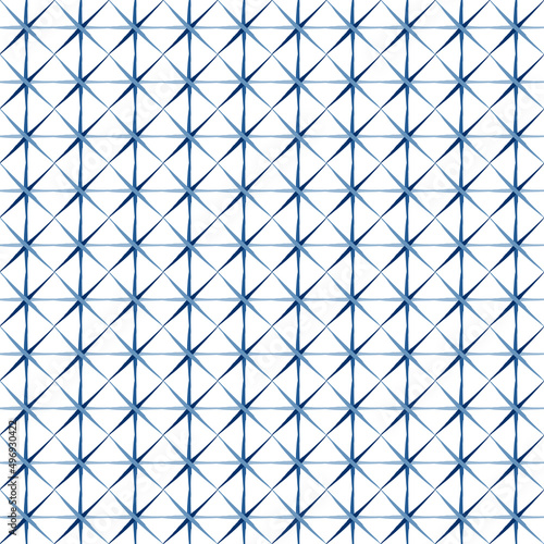 Geometrical grid seamless pattern. Ornamental ethnic surface layer in blue tones color. Hand drawn doodle line. Shibori dyeing effect. White easy editable color background. Vector