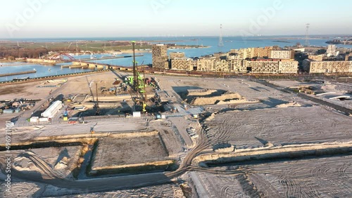 Construction site of a residential area new build living urban city buildings development site. City planning and early stages of construction. photo