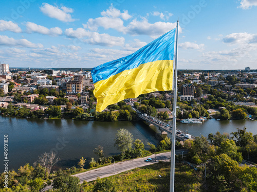 Ukraine flag on background of panoramic provincial country town Vinnitsa beautiful city with river photo