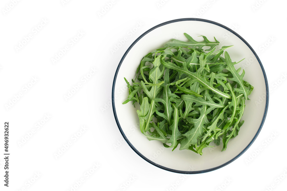 Green arugula leaves on white isolated background Green arugula leaves on white isolated background