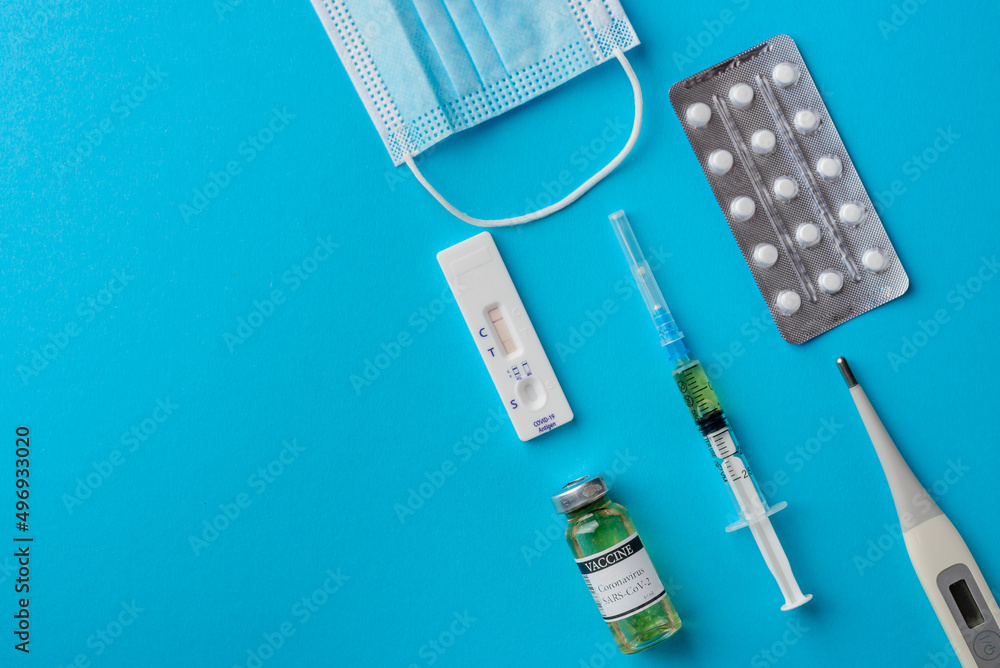 Fototapeta premium Testing for covid-19, vaccination, treatment and protection against coronavirus infection, medical accessories, top view with space for text