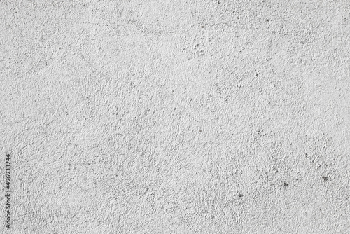 Plastered light gray wall surface background with scratches and cracks. High resolution grungy wall texture