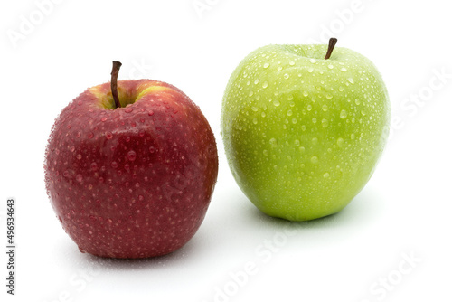 Two apples - red and green apple on white background with water drops