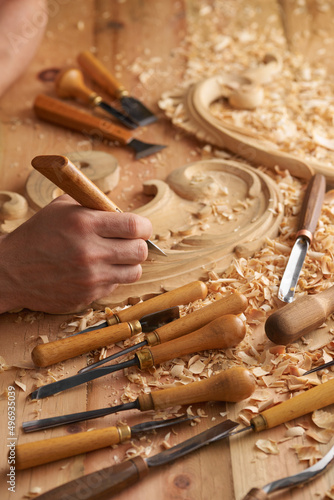 Carpenter wood carving equipment. Woodworking, craftsmanship and handwork concept. Wood processing. Joinery work Wood carving Chisels for carving on the woodworker desk Timber Joinery work.