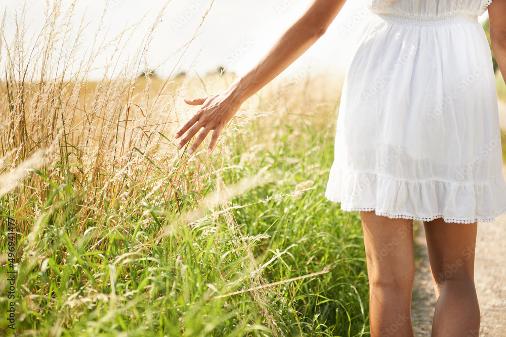 Enjoying the countryside. Cropped shot of a woman in a wheat field. Enjoying the countryside. Cropped shot of a woman in a wheat field.