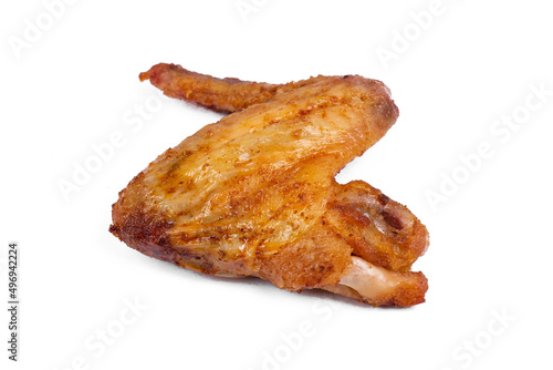 Fresh roasted chicken wing quarters on white isolated background © Natia