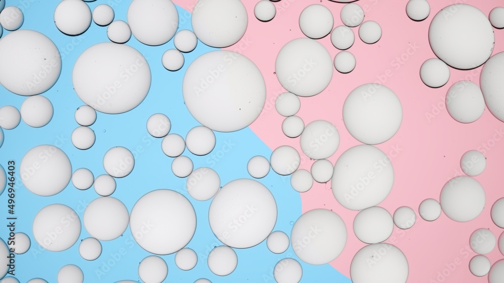 Light grey different sized cream drops floating against multicolored background | Background for body care product commercial shot Light grey different sized cream drops floating against multicolored background | Background for body care product commercial shot