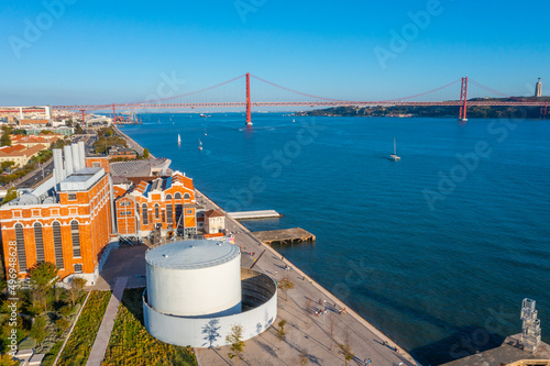 Bridge of 25th April and National sanctuary of Cristo Rei in Lisbon viewed from the MAAS museum, Portugal photo