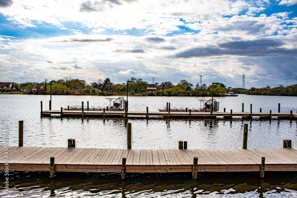 Homes Line the Waterfront Across from a Large Dock in the Bayou in Lafitte, Louisiana, USA