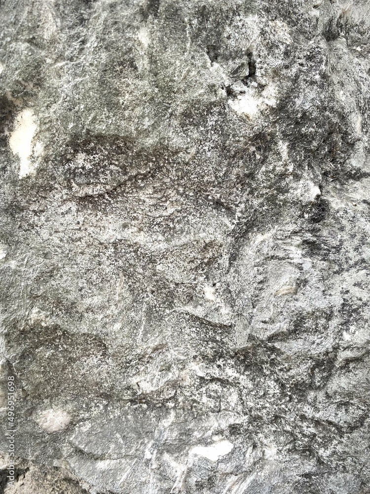 blurred background of granite stone wall, close up stone texture blurred background of granite stone wall, close up stone texture