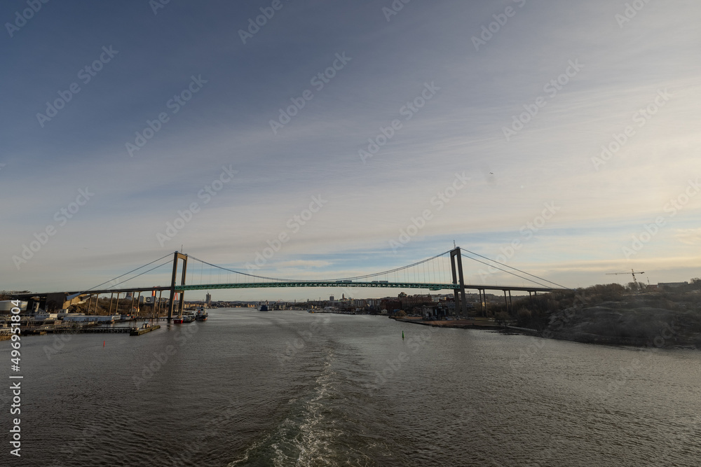 View of magnificent Älvsborgsbron bridge in Gothenburg as viewed from the passing ship. Cloudy overcast day. View of magnificent Älvsborgsbron bridge in Gothenburg as viewed from the passing ship. Cloudy overcast day.