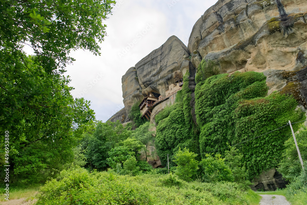 Stone monastery in the mountains. Kalabaka, Greece summer cloudy day in Meteora mountain valley. close up