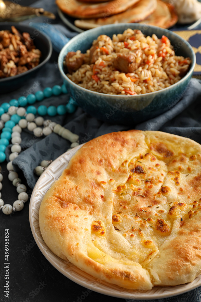 Traditional Eastern flatbread and pilaf on table Traditional Eastern flatbread and pilaf on table