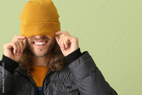 Funny young man in warm clo...