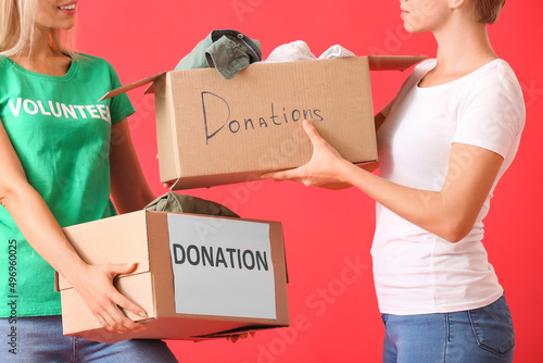 Young women holding boxes w...