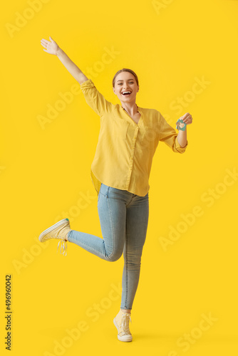 Happy young woman with key ...
