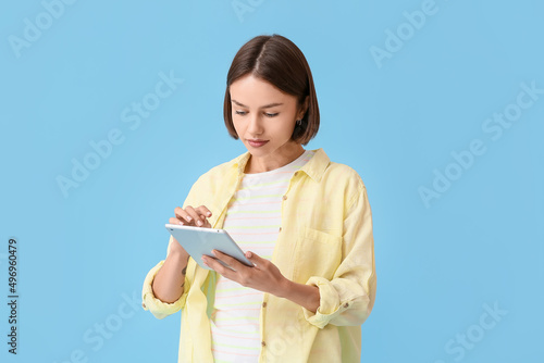 Young woman with tablet on ...
