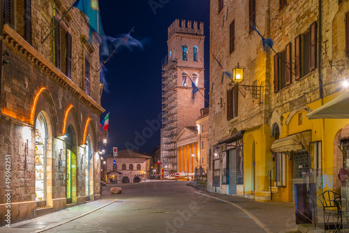 Street leading to Torre del Popolo in the old town of Assisi in Italy #496962251
