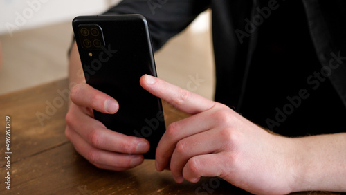 Man secretly taking a photo with a smartphone