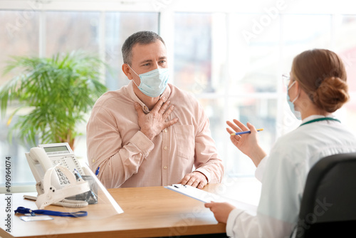 Ill man with sore throat vi...
