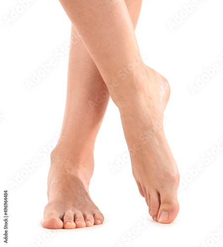 Female bare feet on white background, closeup © Pixel-Shot