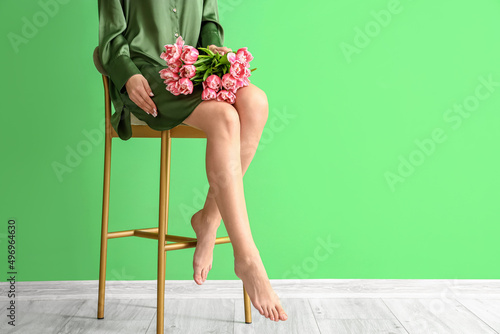 Barefoot woman with tulips ...