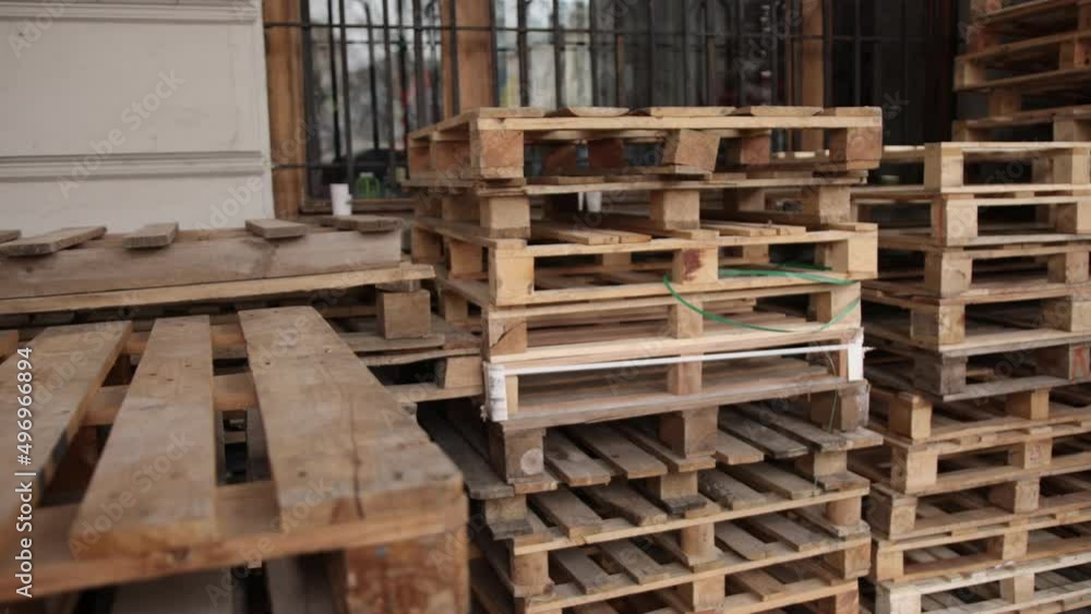 Freight delivery. Shipment. Delivery service. Pallet for packing boxes waiting to be loaded onto a container truck. Supply chain. Logistics and transportation. Stack of wooden pallets for industrial Freight delivery. Shipment. Delivery service. Pallet for packing boxes waiting to be loaded onto a container truck. Supply chain. Logistics and transportation. Stack of wooden pallets for industrial
