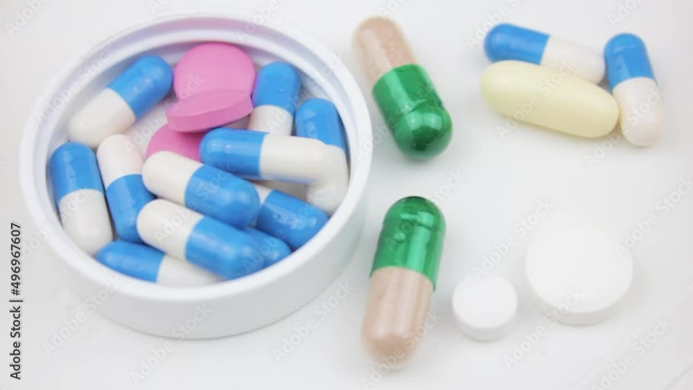 Pick up the tablets with tweezers. Examination of medicines. Research pills and drugs laboratory analysis. Pick up the tablets with tweezers. Examination of medicines. Research pills and drugs laboratory analysis.