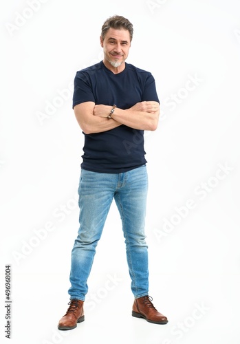Middle age casual man in jeans and t-shirt. Mid adult, mature age man, happy smiling. Full length portrait isolated on white.