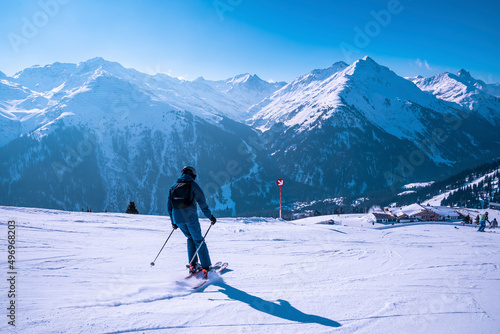 Canvas Print Skier skiing on snow covered landscape