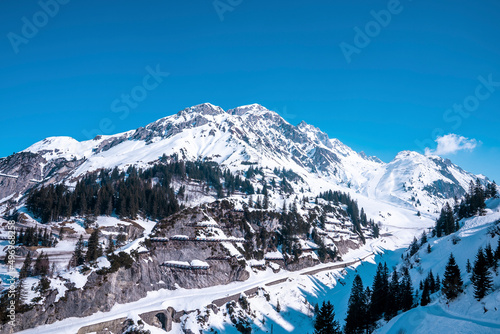 Avalanche barriers on snow covered mountain. Scenic landscape against clear blue sky. Concept is protection.