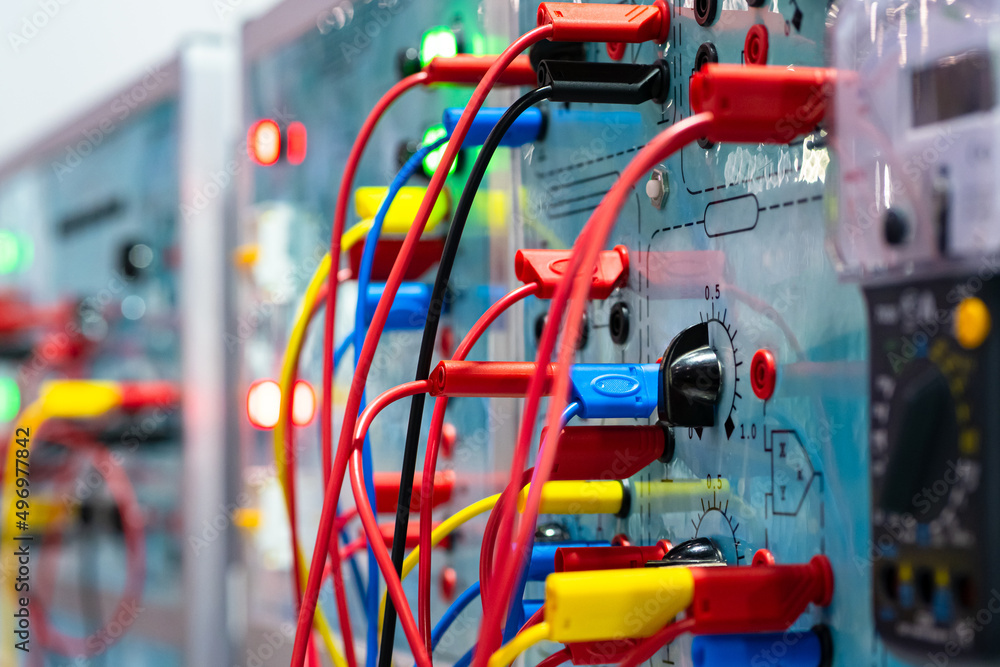 Electrical equipment. Electrical panel with many wires. Multicolored wires are connected to