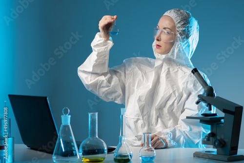 Chemist in protective suit....